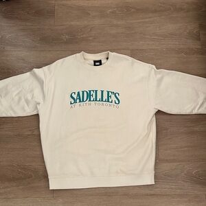 Kith Cream Crewneck Sweater with Teal Accents